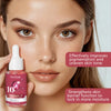 Woman holding a skincare serum bottle with text about its benefits on a plain background
